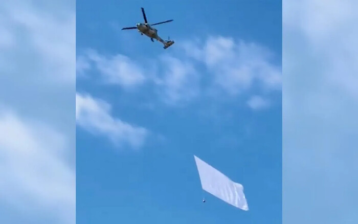 Helicóptero de fuerzas armadas ondea bandera blanca en Culiacán